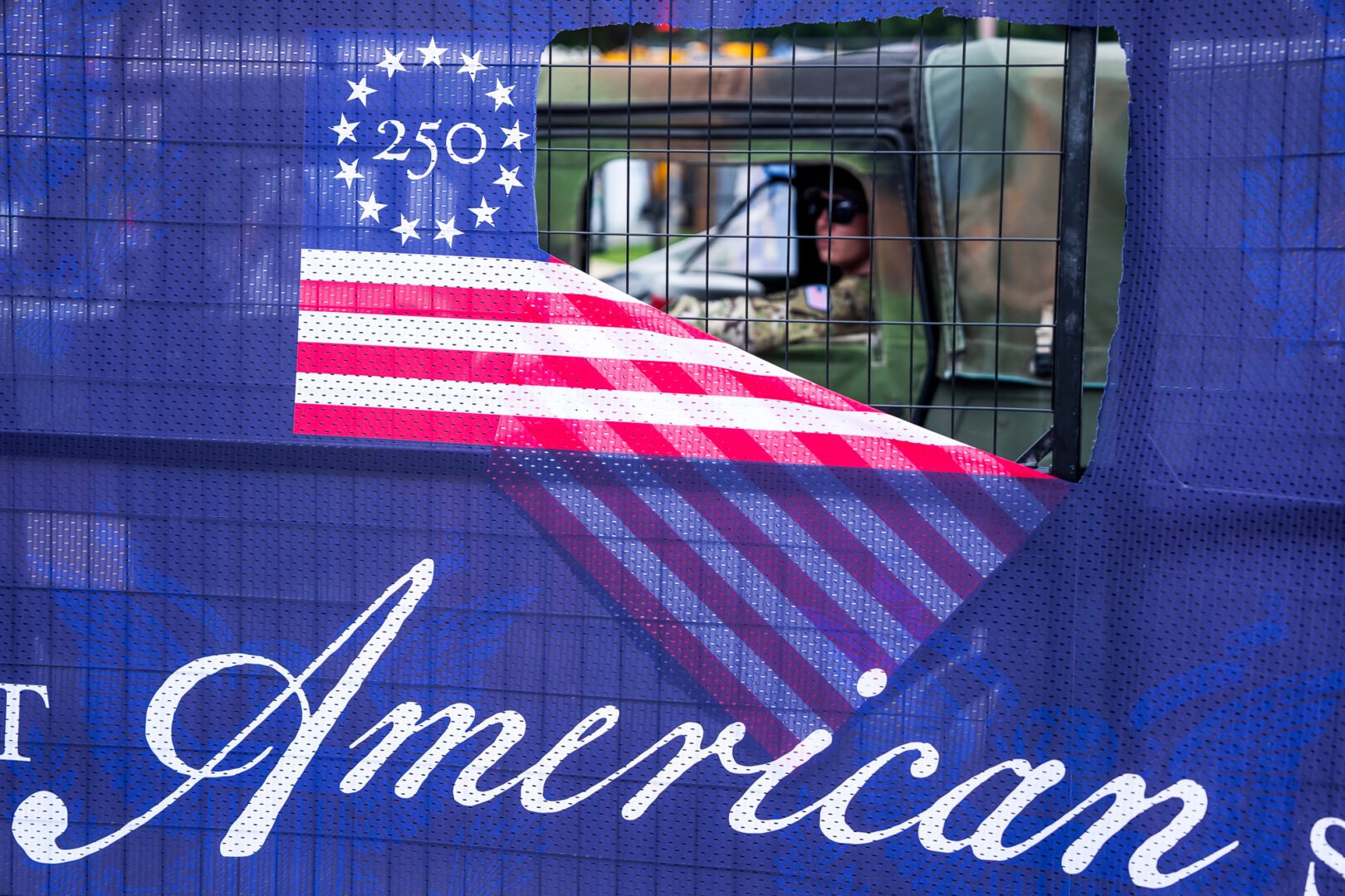 A National Guard soldier is seen inside the perimeter of the Great American State Fair as attractions were being disassembled on Sunday. The fair ran from June 25th to July 10th.