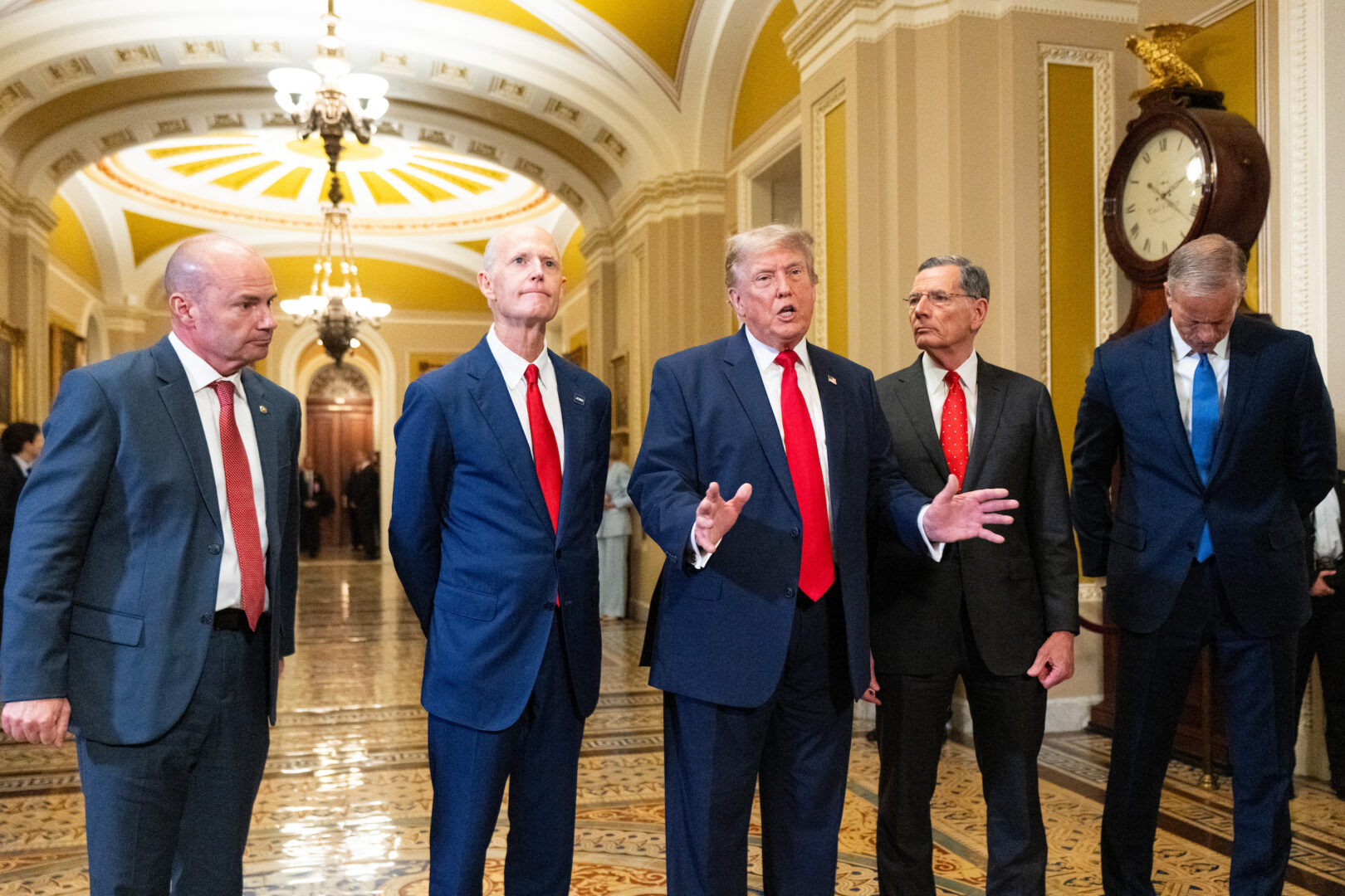 President Donald Trump speaks to reporters in the Capitol on June 24, 2026. Trump is flanked from left by Sens. Mike Lee, R-Utah, Rick Scott, R-Fla., John Barrasso, R-Wyo., and Senate Majority Leader John Thune, R-S.D.