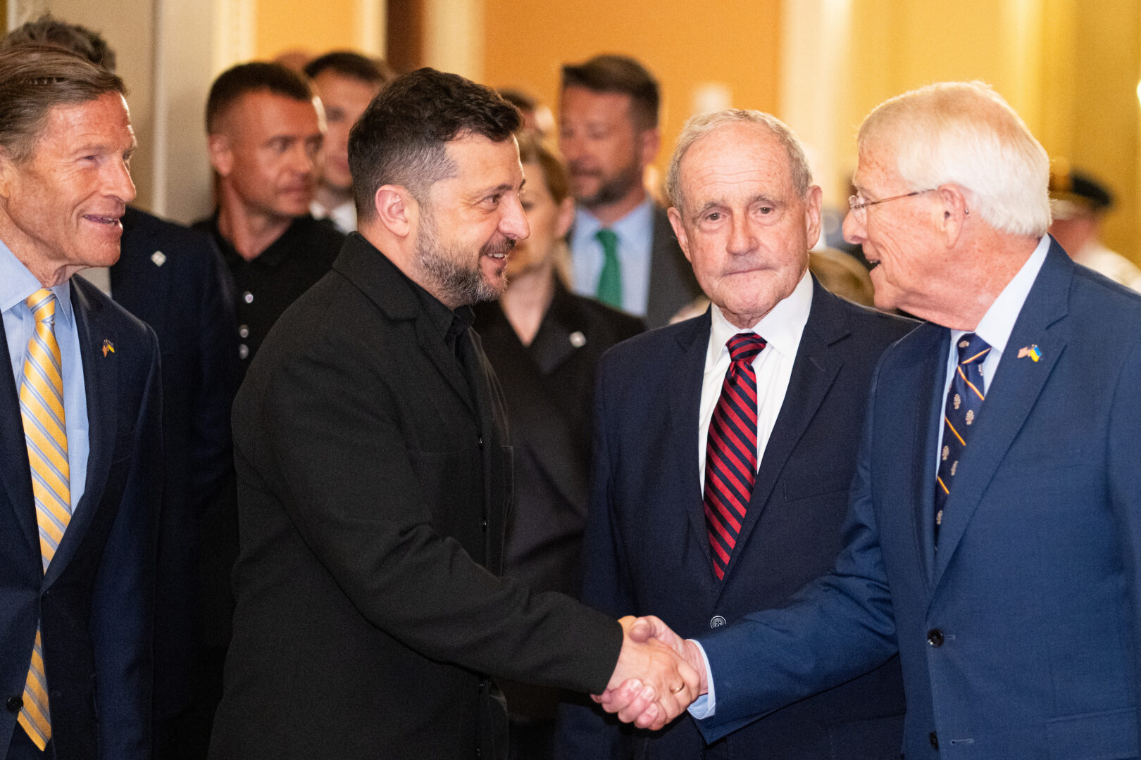Ukrainian President Volodymyr Zelenskyy is greeted, from left, by Sen. Richard Blumenthal, D-Conn., Sen. Jim Risch, R-Idaho, and Sen. Roger Wicker, R-Miss., as he arrives to meet with senators in the Capitol on Tuesday.