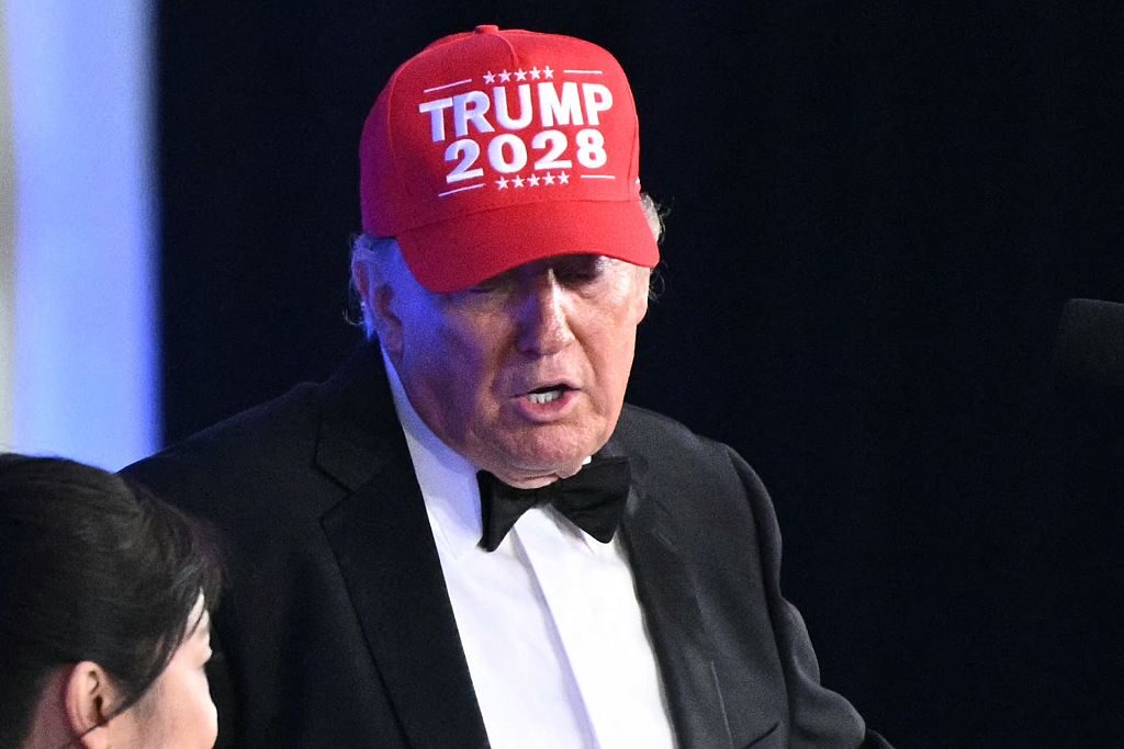President Donald Trump wears a “Trump 2028” hat while he speaks during the 2026 White House Correspondents' Association dinner at the Waldorf Astoria in Washington, D.C., on July 24. 
