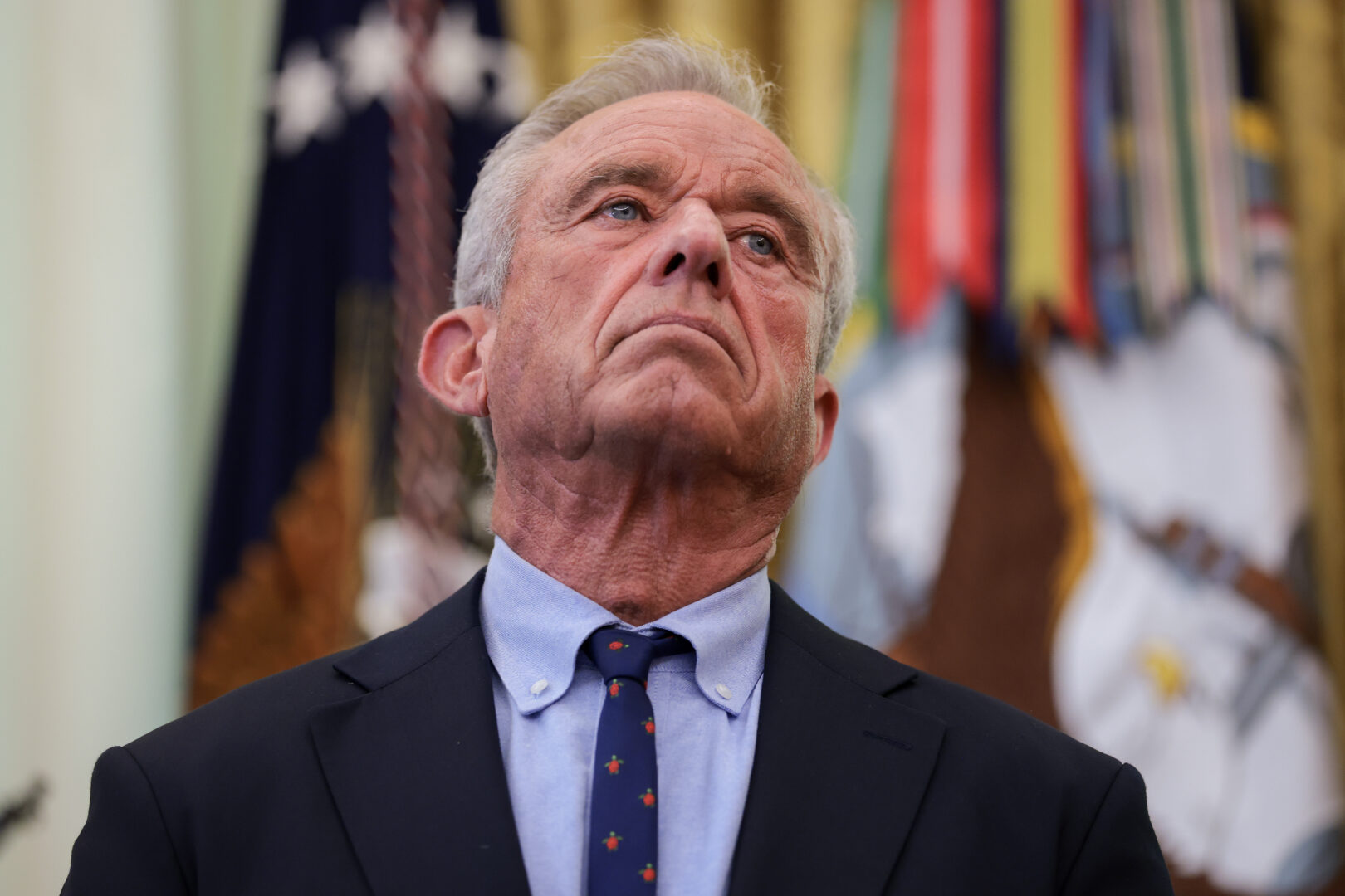 Health and Human Services Secretary Robert F. Kennedy Jr. joins President Donald Trump as he signs an executive order on Monday calling for childhood vaccine shots to be spaced out into separate visits.