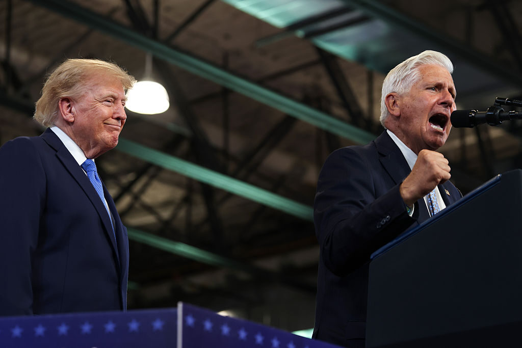 President Donald Trump listens as New York Republican gubernatorial nominee Bruce Blakeman speaks at an event Friday in Garden City, N.Y.