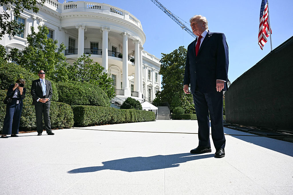 President Donald Trump speaks to the press on Wednesday next to ongoing construction of a helipad on the South Lawn of the White House. His top legislative affairs aide, James Braid, is leaving that post later this month.