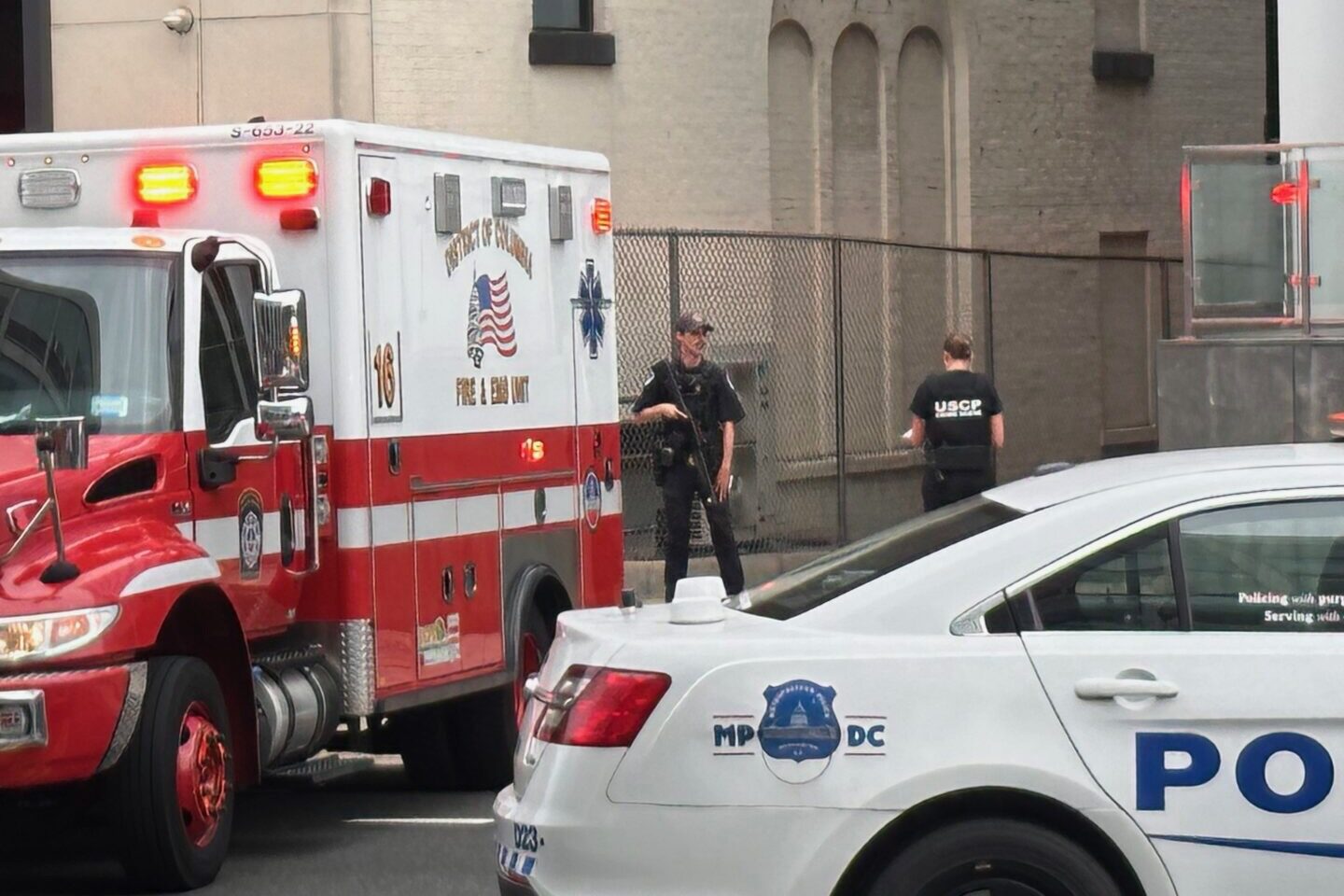 Police officers secure the crime scene at E Street NW on Thursday morning. (Jason Dick/CQ Roll Call) 