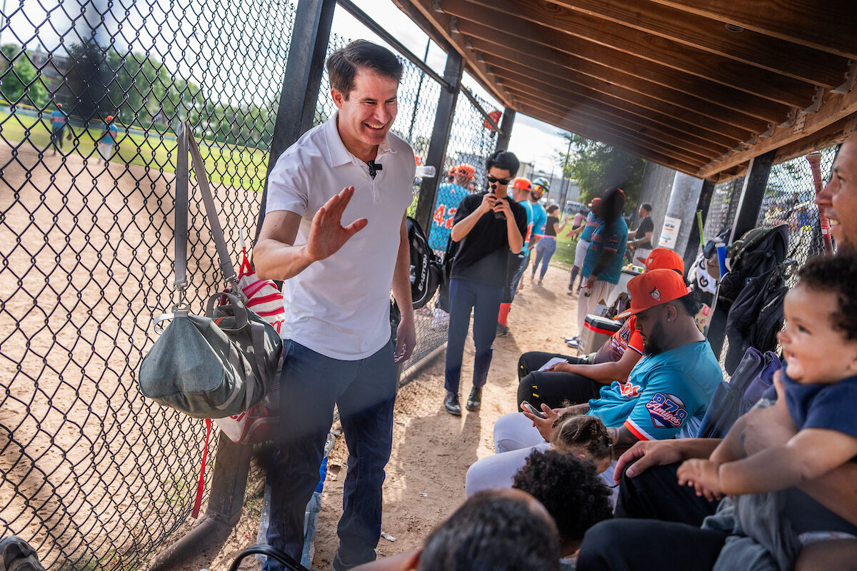 Massachusetts Rep. Seth Moulton, a Democratic candidate for Senate, greets people at a Latinos Unidos softball game in Lawrence, Mass., on Aug. 16. (Tom Williams/CQ Roll Call)