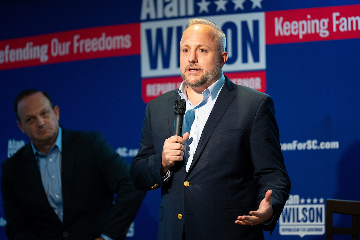 South Carolina Rep. Russell Fry speaks at a candidate forum for Republican Senate candidates in Charleston on Aug. 6. At left is event organizer Alan Wilson, the state attorney general.