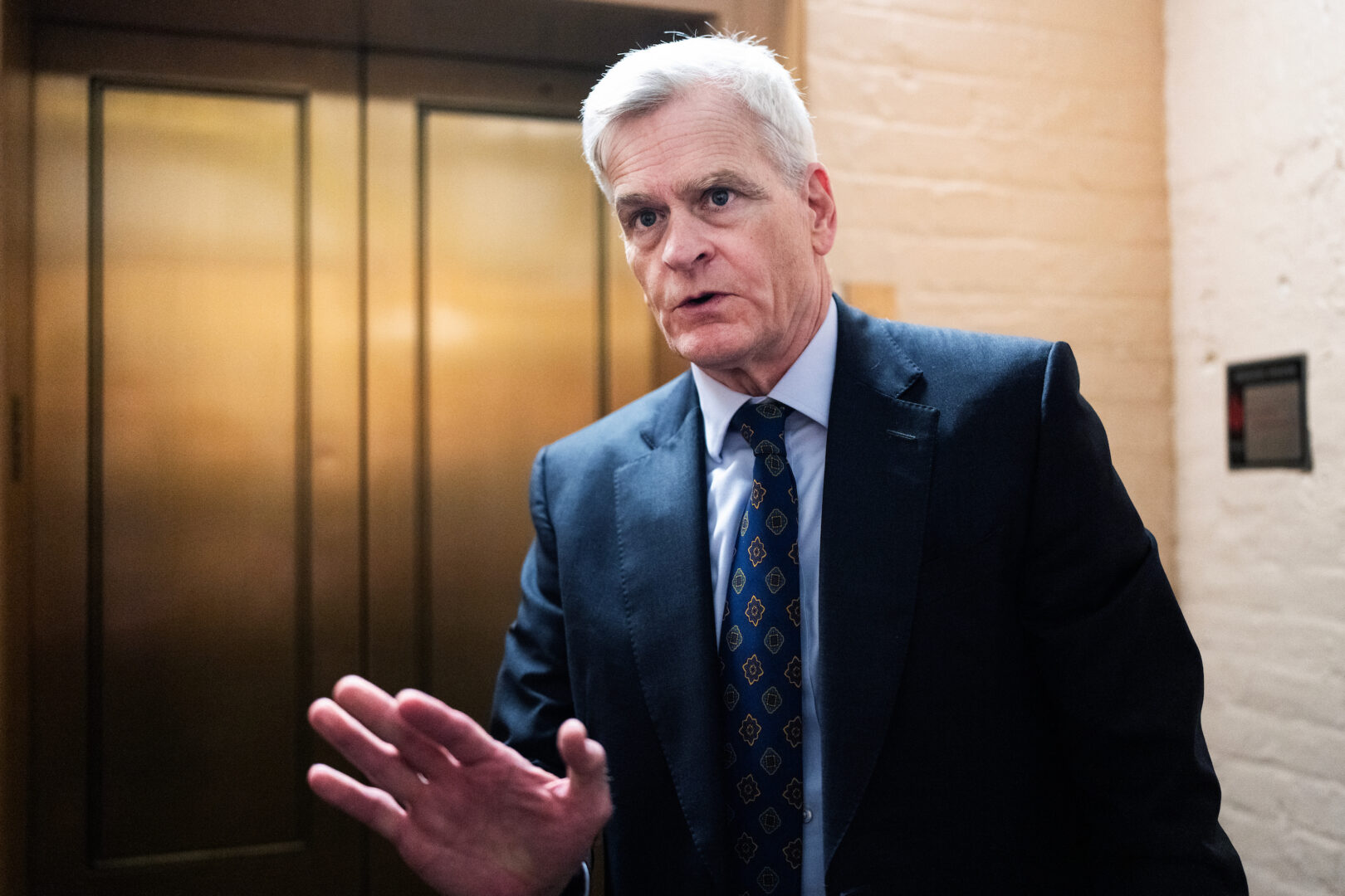 Sen. Bill Cassidy, R-La., talks with reporters in the Capitol this month. 