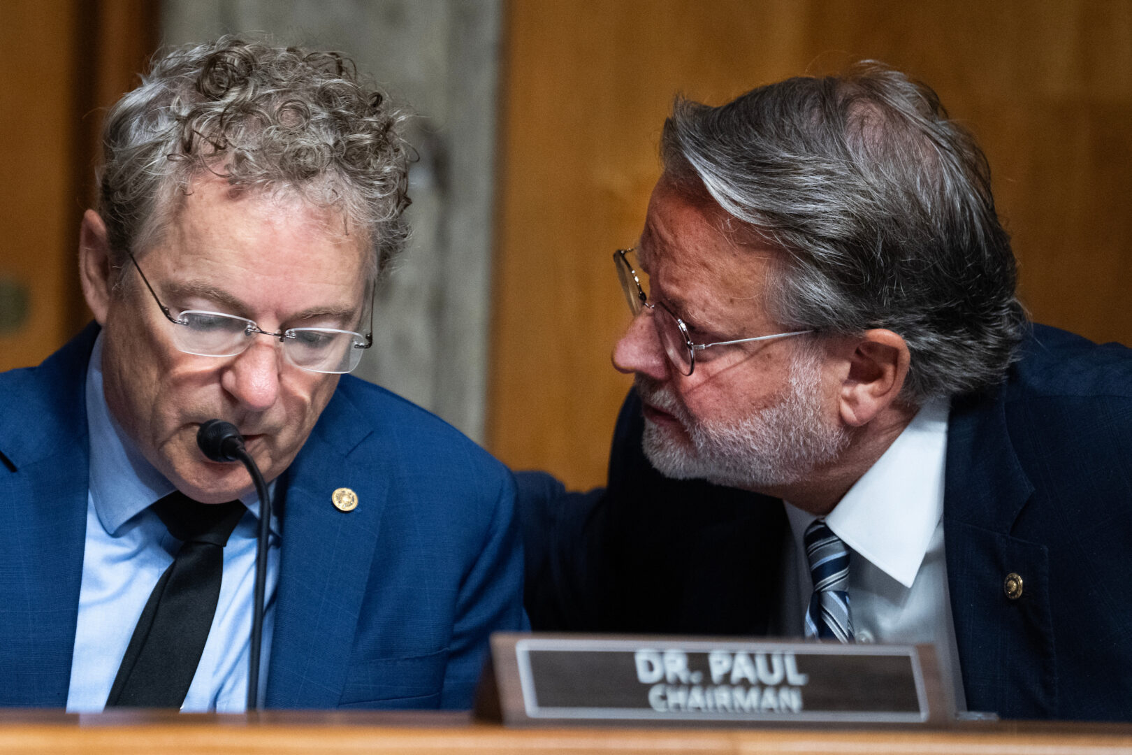 Chairman Rand Paul, R-Ky., left, and ranking member Sen. Gary Peters, D-Mich., before the Homeland Security and Governmental Affairs Committee vote to hold former NIH official Anthony Fauci in contempt of Congress.