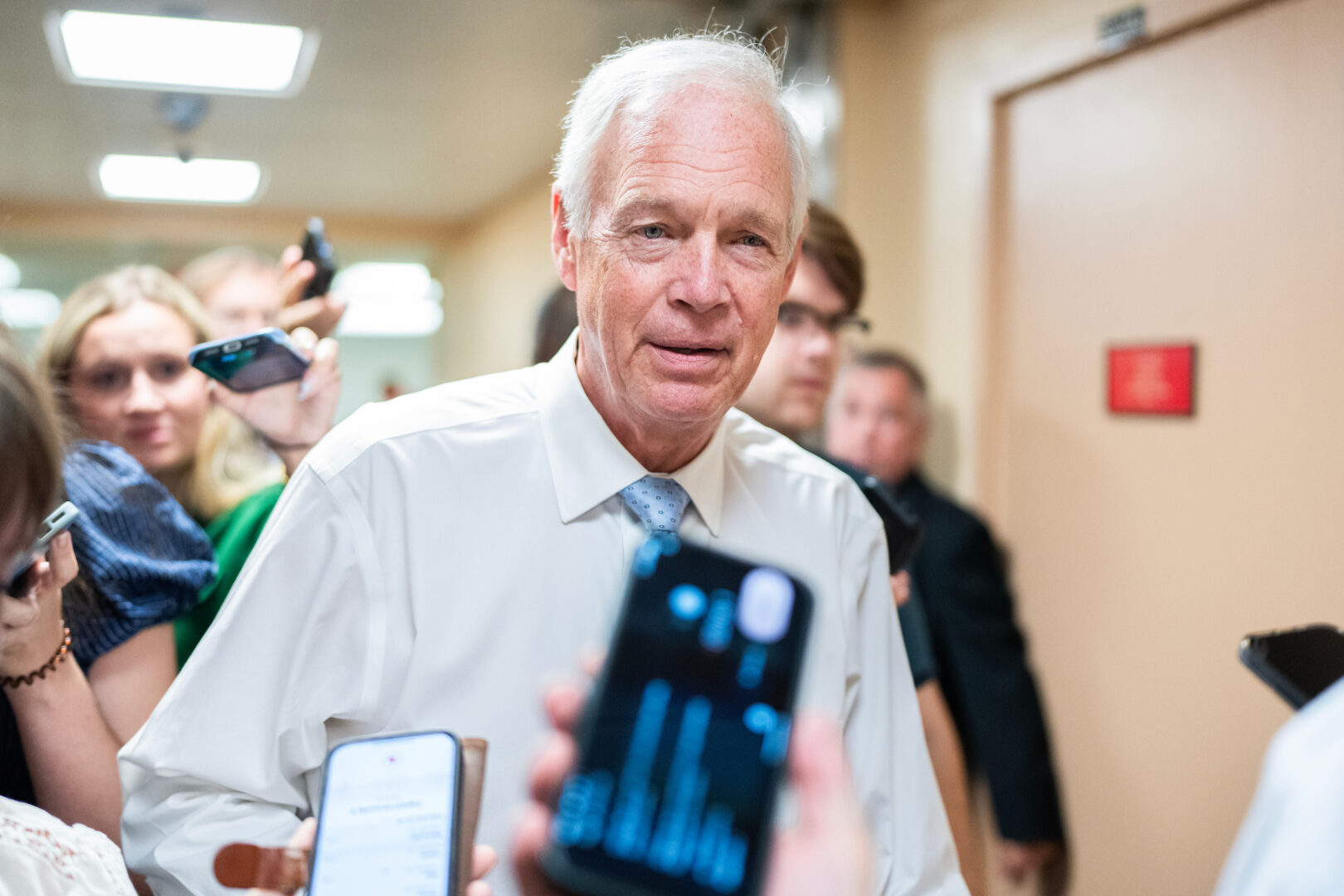 Sen. Ron Johnson, R-Wis., talks with reporters in the Capitol on Friday.