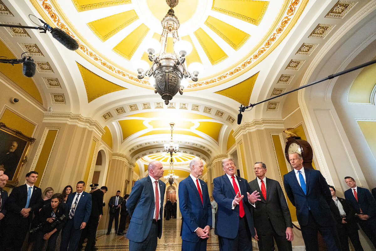 President Donald Trump speaks to the media as he departs a Senate Republican caucus lunch meeting in the Capitol on June 24, flanked, from left, by Sens. Mike Lee, R-Utah, Sen. Rick Scott, R-Fla., John Barrasso, R-Wyo., and Senate Majority Leader John Thune, R-S.D.