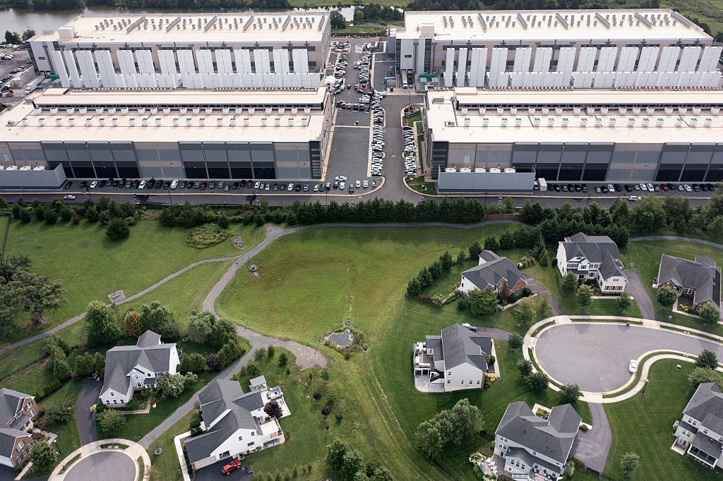 An Amazon Web Services (AWS) data center stands adjacent to single-family homes in Stone Ridge, Va. on Aug. 12, 2026. (Brendan Smialowski/AFP via Getty Images)
