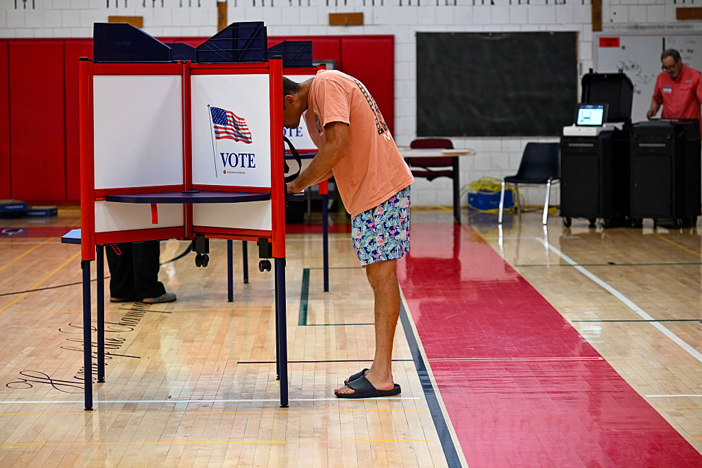 A voter fills out his ballot at the Cromwell High School polling station in Cromwell, Conn. on Aug. 11, 2026. (Ayannah Brown/Connecticut Public via Getty Images)