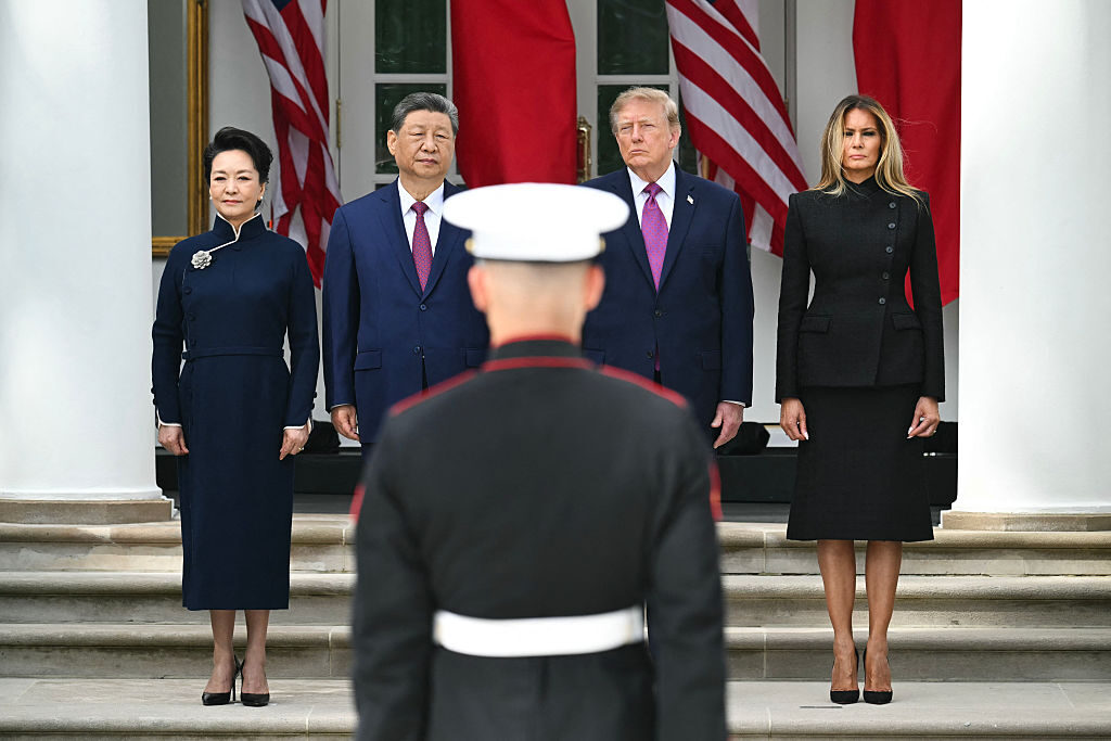 China's first lady Peng Liyuan, Chinese President Xi Jinping, President Donald Trump and U.S. first lady Melania Trump look on during a military review in the Rose Garden of the White House on Thursday. (Saul Loeb/AFP via Getty Images)