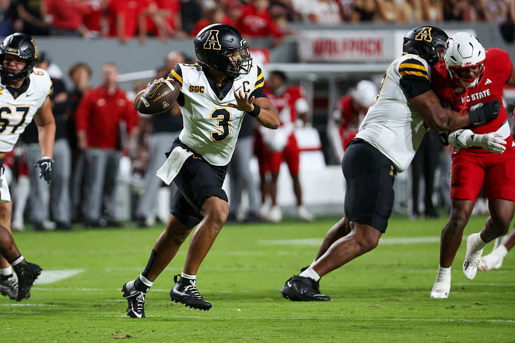 Appalachian State quarterback Malachi Singleton rolls out to pass during the Mountaineers' 41-31 loss to N.C. State on Saturday night in Raleigh, N.C. Singleton came to App State this season from Purdue University via the transfer portal.
