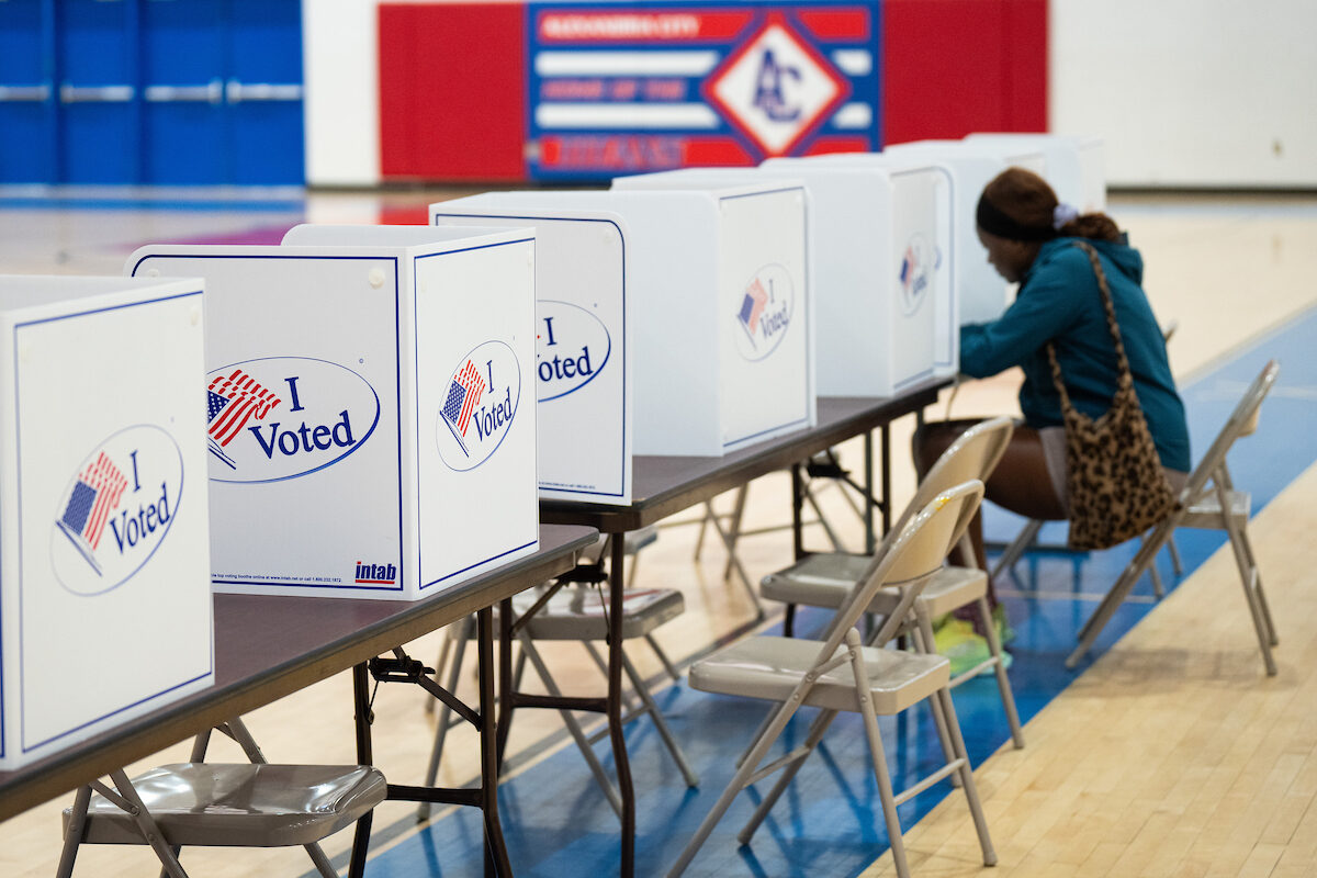 A voter fills out her ballot in the Alexandria City High School gymnasium on Nov. 5, 2024. (Bill Clark/CQ Roll Call)