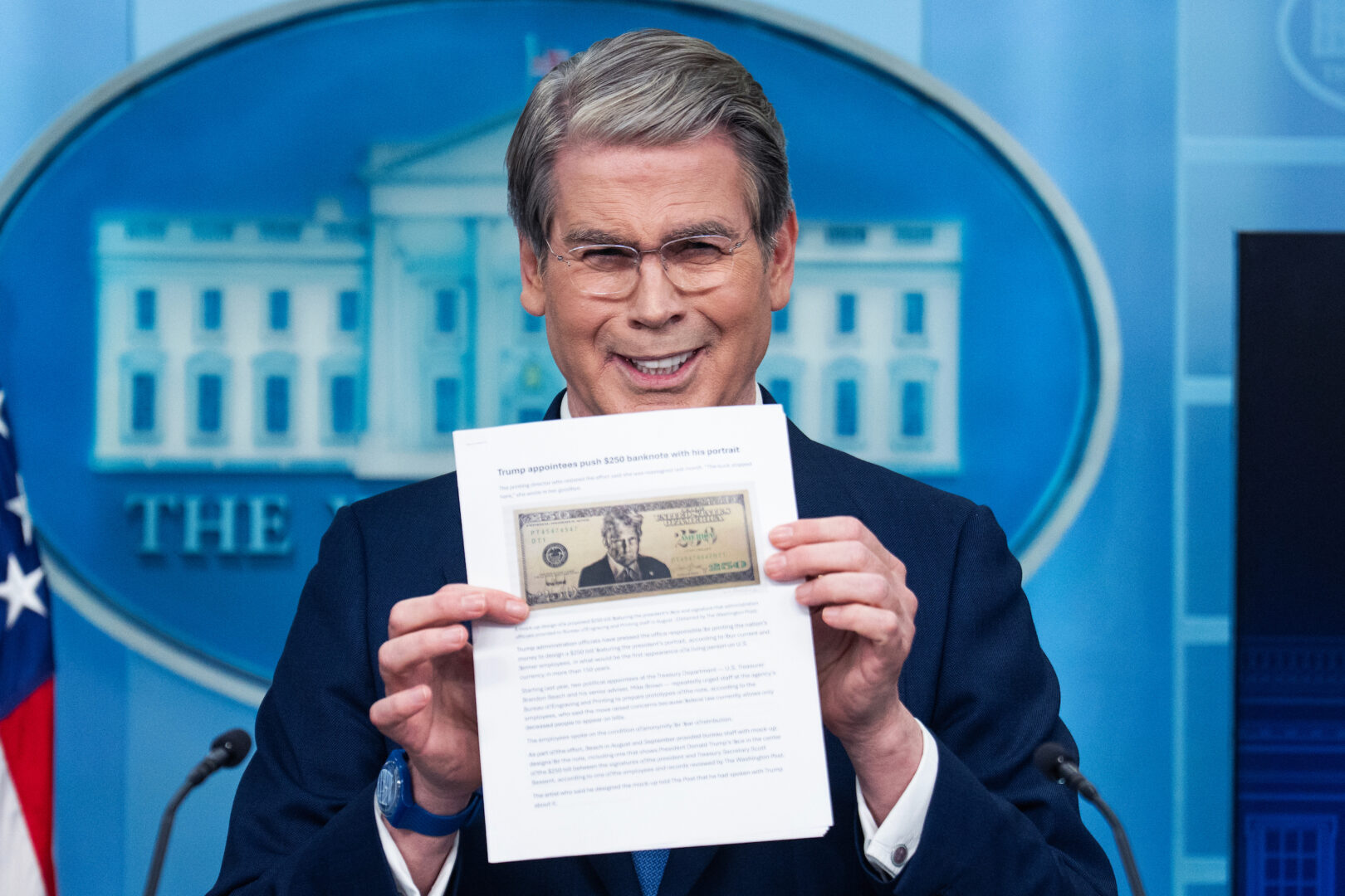 Treasury Secretary Scott Bessent holds a printout of a proposed $250 bill featuring a picture of President Donald Trump during a White House press briefing on May 28.