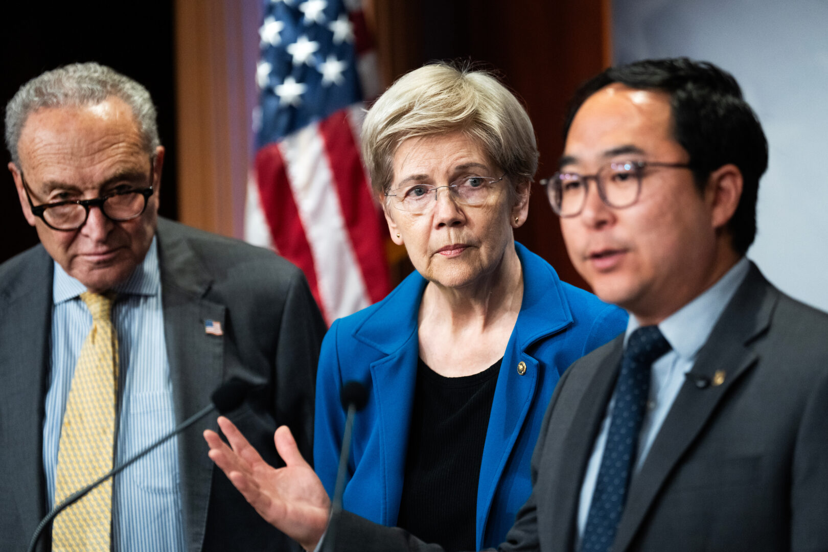 From left, Senate Minority Leader Charles E. Schumer, D-N.Y., Sens. Elizabeth Warren, D-Mass., and Andy Kim, D-N.J., conduct a news conference Wednesday about President Donald Trump's meeting with Chinese President Xi Jinping.