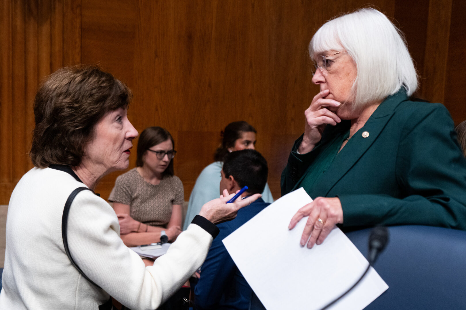 Sen. Susan Collins, R-Maine, left, and Sen. Patty Murray, D-Wash., talk before the start of a Senate Health, Education, Labor and Pensions Committee hearing on Sept. 17.