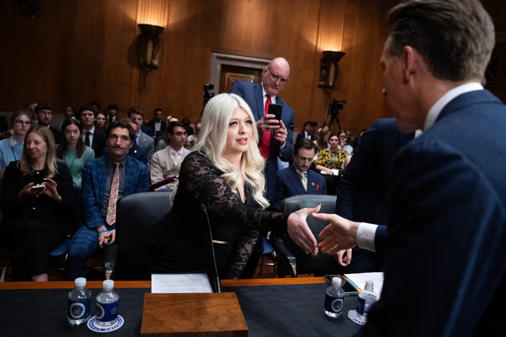 Lindsey Isaacs, who was wrongfully arrested in a fatal hit-and-run in Florida, greets Sen. Josh Hawley, R-Mo., at the Senate Judiciary subcommittee hearing on Flock and other surveillance technology. (Tom Williams/CQ Roll Call)