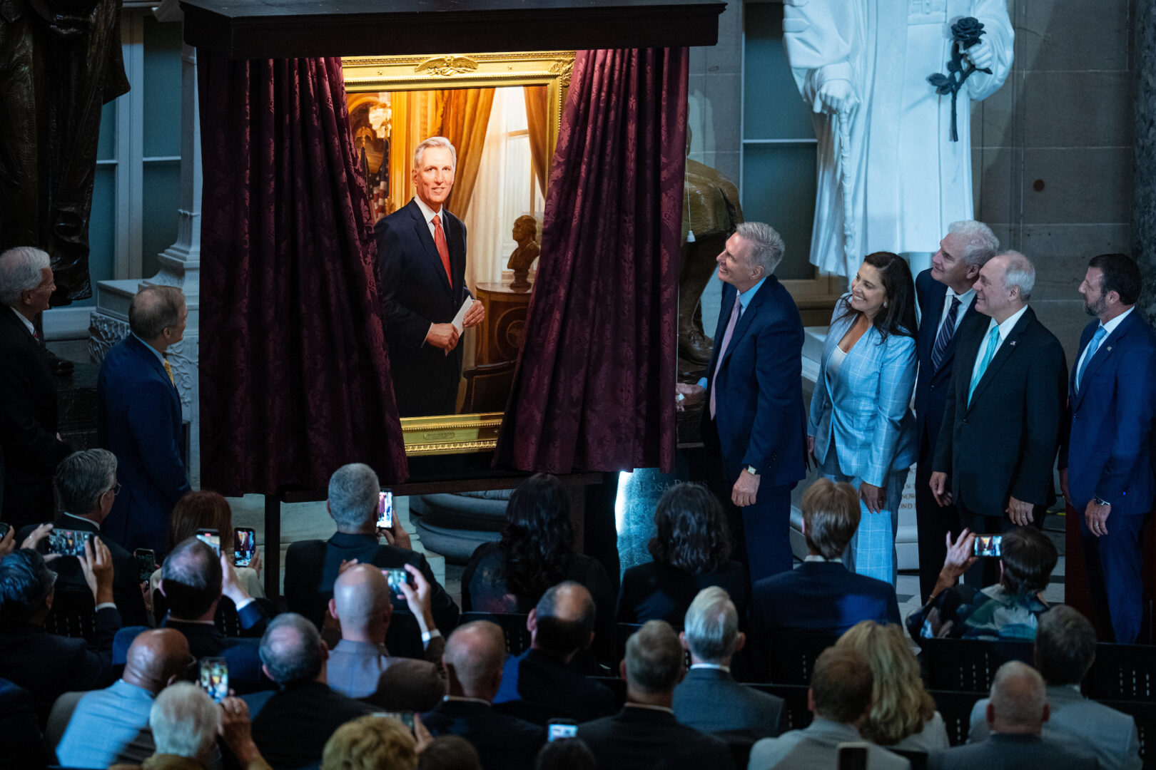Former Speaker Kevin McCarthy, R-Calif., pulls the rope to unveil his portrait in Statuary Hall on Tuesday.