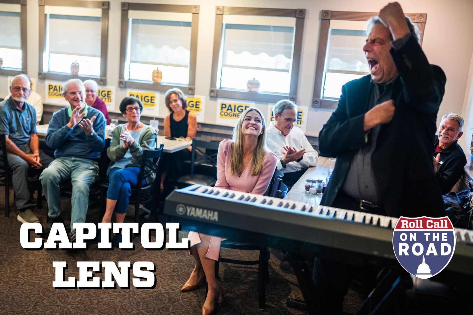 Scranton Mayor Paige Cognetti, Democratic candidate for Pennsylvania’s 8th District, listens to Jon “Bowzer” Bauman, president of Social Security Works PAC — and former signer for the band Sha Na Na — perform during a campaign event in Jessup, Pa., on Oct. 7, 2026.
