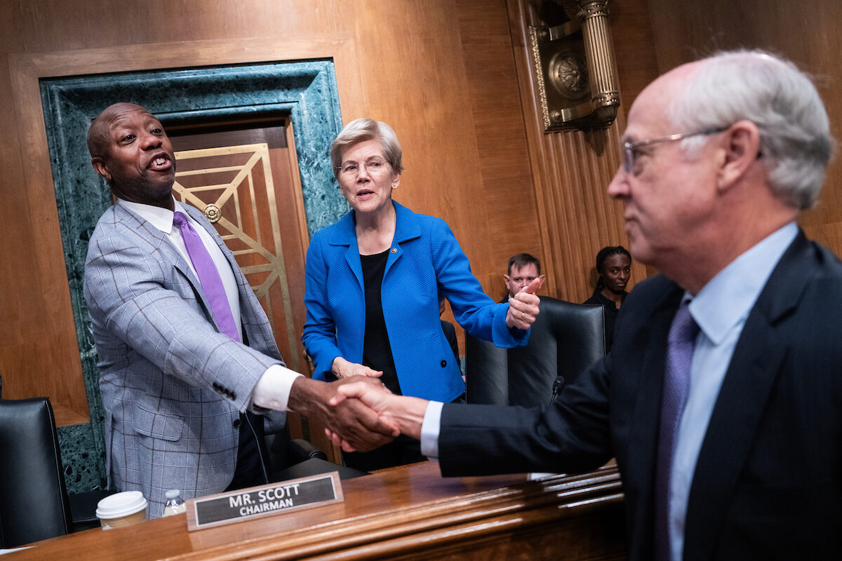 Sens. Tim Scott and Elizabeth Warren greet David Slade, nominee for a top Export-Import Bank post, after a confirmation hearing on Thursday. (Tom Williams/CQ Roll Call)